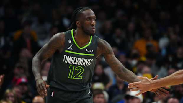Timberwolves forward Taurean Prince high-fives a teammate.